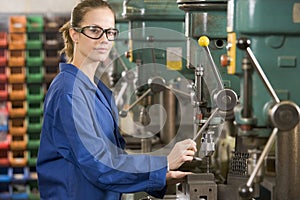 Machinist working on machine