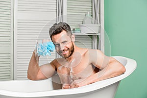 Macho man washing in bath. desire and temptation. hygiene and health. Morning shower. man wash muscular body with foam