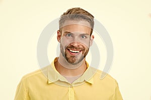 Macho with perfect smile on unshaven face isolated on white background. Happy man with beard. Bearded and handsome. Skin