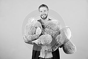 Macho smile with grey teddy bear. Happy man big animal toy. Man smile with big animal toy. Gift and present concept photo