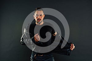 Macho undress leather jacket. Man with beard on unshaven face. Fashion model in casual style clothes. Style and trend photo