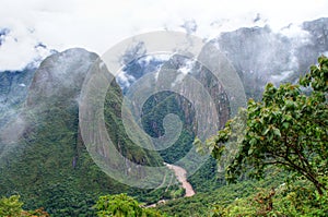 Machu Picchu aerial view to mountains in fog