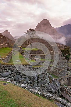 Machu Picchu, Cusco, Peru in the morning mist, found on the steep slopes of the Andes Mountains