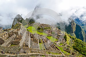 MACHU PICCHU, CUSCO REGION, PERU- JUNE 4, 2013: Panoramic view of the 15th-century Inca citadel Machu Picchu