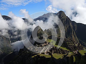 Machu Picchu with with a dramatic Panorama as the morning clouds lift, Peruvian Andes, South America