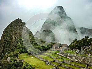 Machu Picchu, `the lost city of the Incas`, an ancient archaeological site in the Peruvian Andes mountains. Cusco, Peru