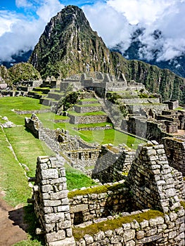 Machu Picchu, `the lost city of the Incas`, an ancient archaeological site in the Peruvian Andes mountains. Cusco, Peru