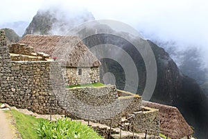 Machu Picchu's house and cloudy mountains