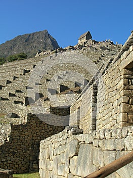 Machu Picchu terraces looking up to guardhouse photo