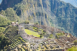 Machu Picchu terraces steep view from above to Urubamba valley below. Peru travel destination, tourism famous place.