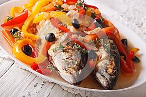 Mackerel in vegetable marinade close-up on the table. horizontal