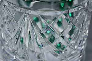 Macro abstract background of a beautiful vintage hand-cut lead crystal glass jar with diamond shape cuts