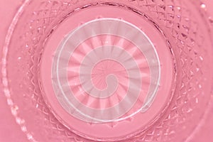 Macro abstract texture background of a rosy pink color round crystal glass