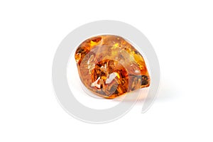 Macro Amber mineral stone with spider on white background