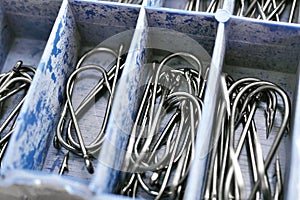 Macro of assorted fishhooks. Set of fishing hooks in tackle box photo