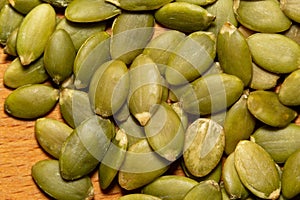 Macro background texture of green pumpkin seeds