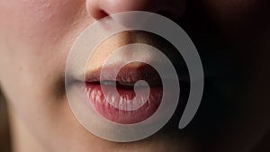 Macro of beautiful young woman mouth opening. Natural perfect female lips.