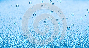 Macro of blue air bubbles in water
