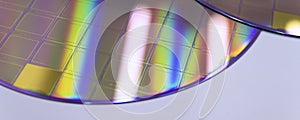 Macro of blue silicon wafer with microchips. Banner format