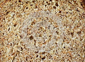 Macro brown bread slices texture background.