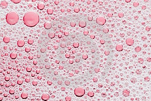 Macro bubble of pink water background, transparent bath soap