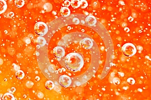 Macro bubbles of oxygen in the blood. Red-orange liquid