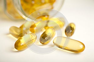 Macro of a bunch of yellow gel pills.