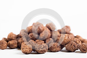 Macro of chocolate cereal in white background