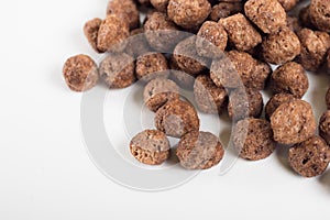 Macro of chocolate cereal in white background