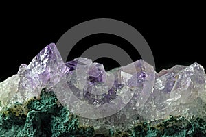 Macro close-up of an amethyst mineral crystal cluster