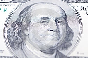 Macro close up of Ben Franklin's face on the US $100 dollar bill