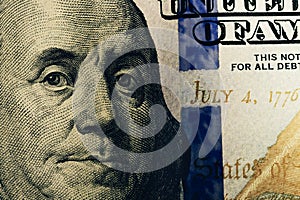 Macro close up of Ben Franklin`s face on the US 100 dollar bill. Dollars Closeup Concept. American Dollars Cash Money