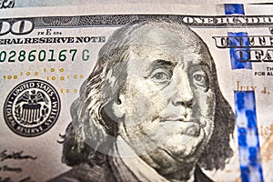 Macro close up of Ben Franklin`s face on the US $100 dollar bill