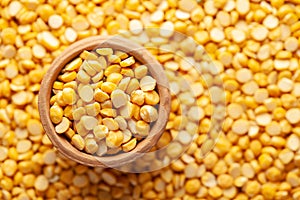 Macro Close-up of  Organic Bengal Gram Cicer arietinum or split yellow chana dal in an earthen clay pot kulhar