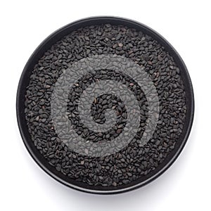 Macro Close up of Organic Black Sesame seedsSesamum indicum or Black Til with shell inside a black ceramic bowl photo