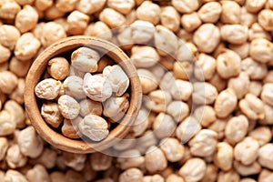 Macro Close-up of Organic chhole chana or Kabuli chana Cicer arietinum or whole white Bengal gram dal in an earthen clay pot