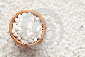 Macro close-up organic white  sago or sabudana big size in an earthen clay pot kulhar on the self background.