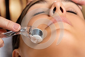 Macro close up portrait of woman having beauty skin tightening t photo