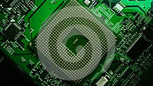 Macro Close-up Shot of CPU Processor Socket on Green Printed Circuit Board or Computer Motherboard