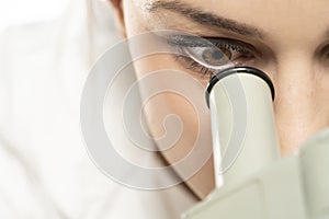 Macro Close Up Shot of a Female Scientist Looking into the Microscope