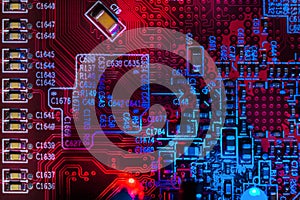 Macro close-up shot of microchip, cpu processor on red circuit board, computer motherboard with components inside electronic