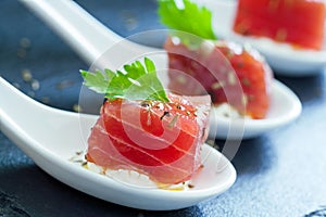 Macro close up of tuna morsel.
