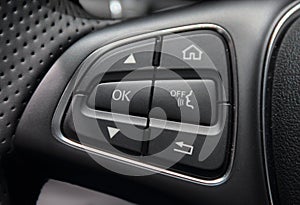 A macro close up view of command buttons on the steering wheel photo