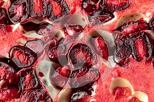 A macro close up view of a cut open pomegranate.