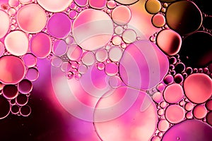 Macro close up of water bubbles with copy space over multi coloured background