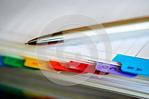 Macro closeup of alphabetical index of address book with mechanical pencil