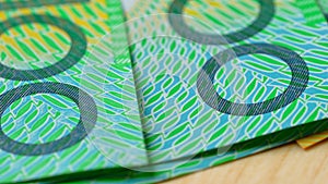 Macro closeup of Australian one hundred dollar notes.