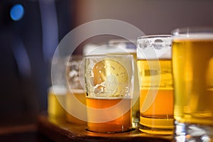 Macro closeup of a beer flight in sunlight