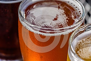 Macro closeup of beer in sample glasses