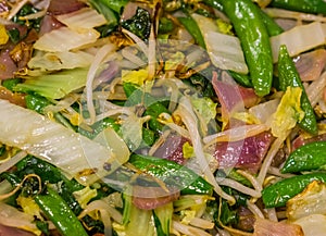 Macro closeup of a cooked asian vegetable mix, healthy vegan food background